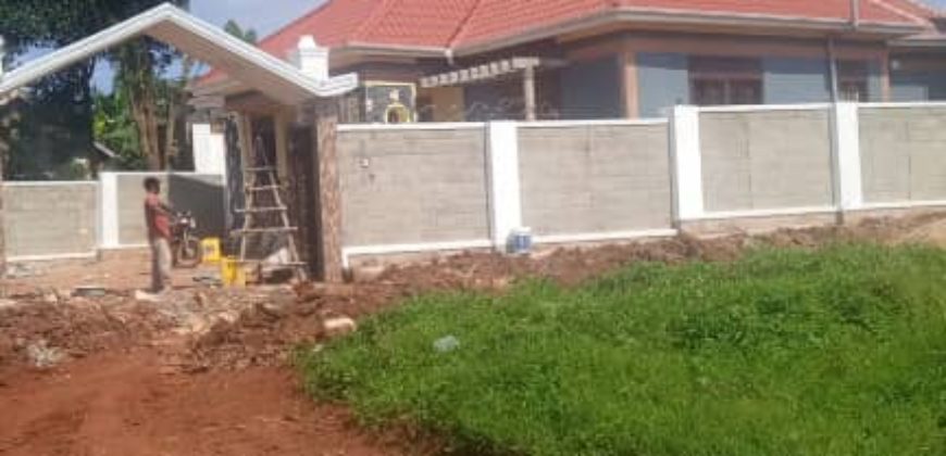 Newly built residential house with a private mailo land title in Nkoowe at 250 million